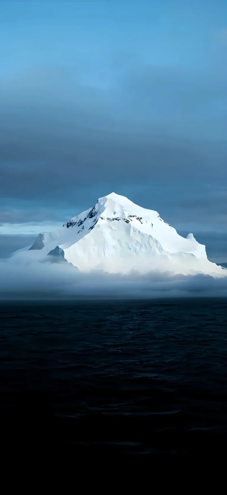 深海海面云雾覆雪山峰渐变冷蓝竖版极地风景壁纸
